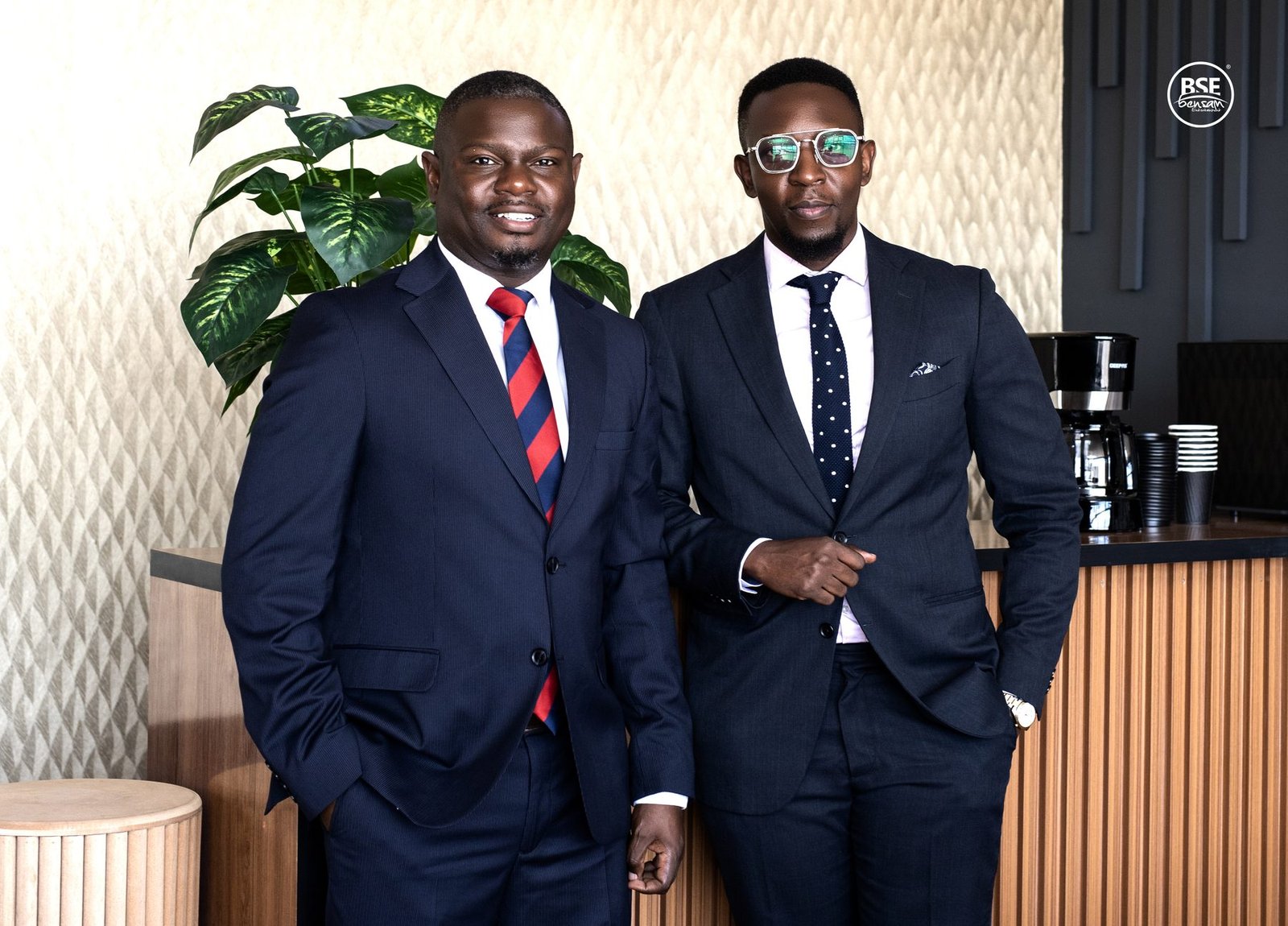 Two executives beside a coffee station